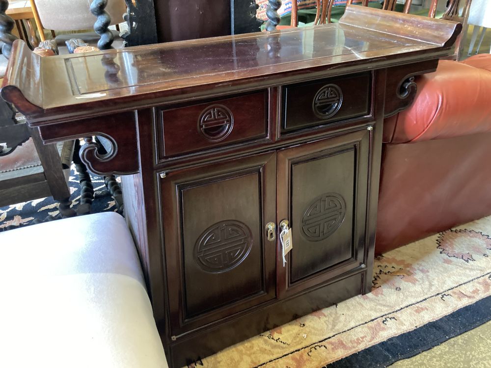 A Chinese carved hardwood side cabinet, width 95cm, depth 41cm, height 81cm